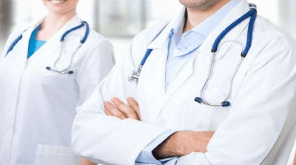 Two physicians in white coats with stethoscopes